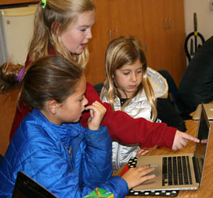 A fifth grade Code Coach helps out